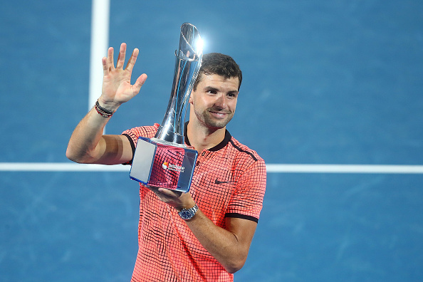 Grigor Dimitrov poses with the Brisbane International title after beating Kei Nishikori in the final (Getty/Chris Hyde)