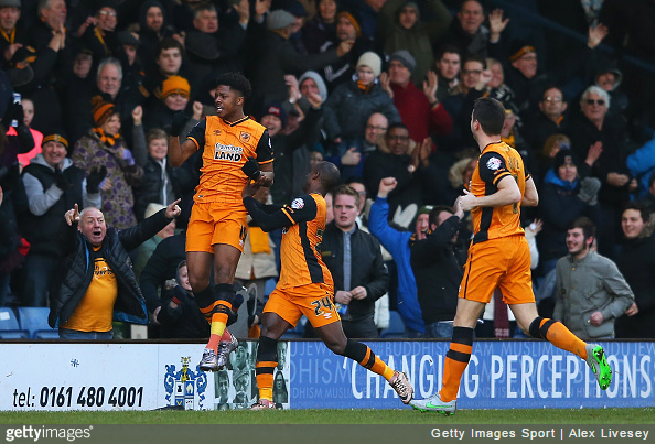 Akpom celebrates.