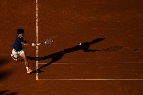 Hyeon Chung chases down a forehand during his loss in Barcelona. Photo: David Ramos/Getty Images