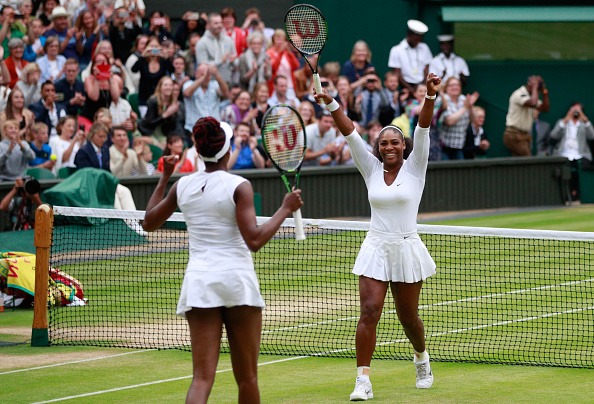 Williams sisters celebrate victory (Photo: Adam Pretty/ Getty Images)