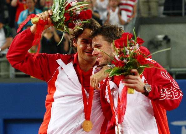 Federer and Wawrinka celebrate winning the gold for their native country of Switzerland in the 2008 Olympics men's doubles competition. Credit: Clive Brunskill/Getty Images