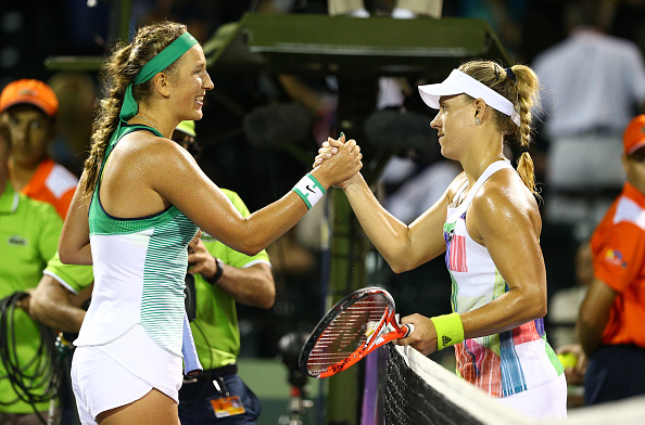 Kerber and Azarenka meet at the net after their semifinal in Miami (Getty/Clive Brunskill)