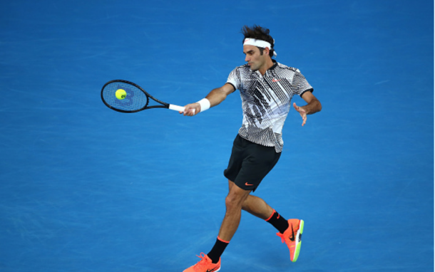 Federer smacks the forehand down-the-line, one of 80 winners the Swiss Maestro hit over the five sets. Credit: Clive Brunskill/Getty Images