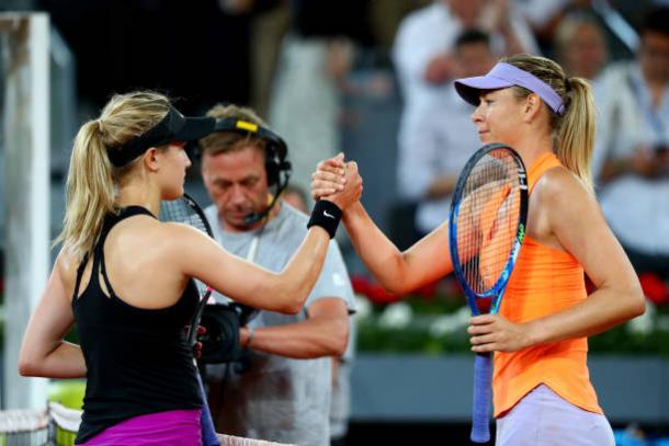 Bouchard and Sharapova meet at the net following their match in Madrid (Getty/Clive Rose)