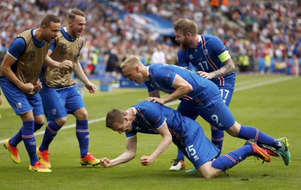 The Icelandic squad wheel away in celebration, after Böðvarsson puts them ahead. | Credit: Uefa