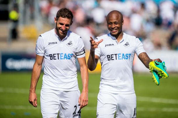 Angel Rangel and André Ayew certainly enjoyed their afternoon in Bristol. (Photo: Swansea City AFC)