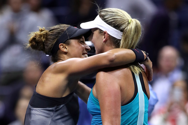 Both players exchange a warm hug after the match | Photo: Matthew Stockman/Getty Images North America