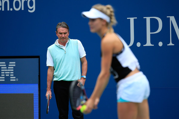 Jimmie Connors (background) looks on during a practice with Eugenie Bouchard at the 2015 US Open. Photo: Chris Trotman/Getty Images