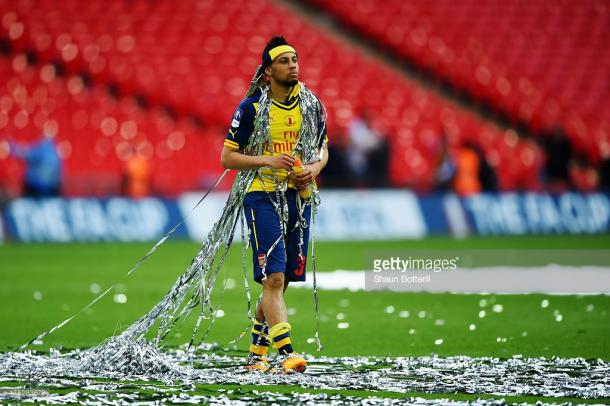 Celebrating one of two FA Cups in Arsenal colours. Source | Getty Images.