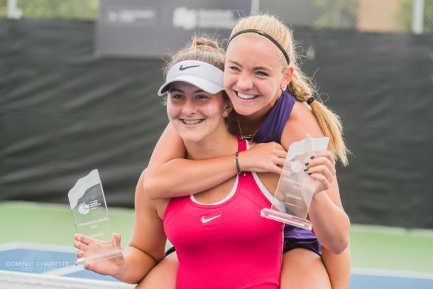 Bianca Vanessa Andreescu and Charlotte Robillard-Millette pose with their respective winners’ trophies after winning the doubles event at the 2016 Challenger Banque Nationale de Saguenay. | Photo: Dominic Charette Photography