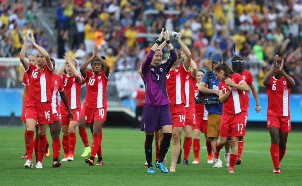 Canada's players applaud the fans that have travelled to back them in Rio, after they secured their place in the quarter-finals. (Photo: Canada Soccer)