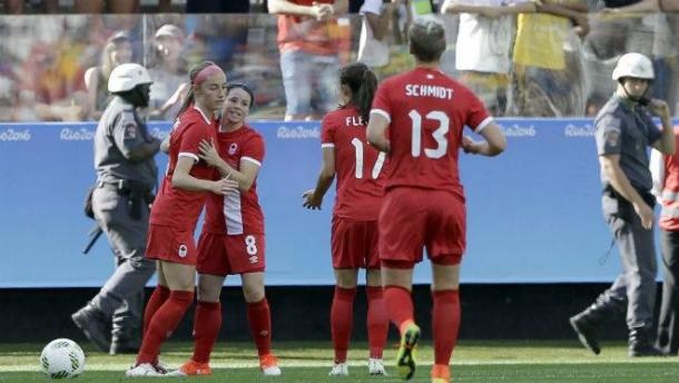 Janine Beckie is congratulated by teammates as Canada celebrate taking the lead against Zimbabwe. (Photo: The Chronicle Herald)