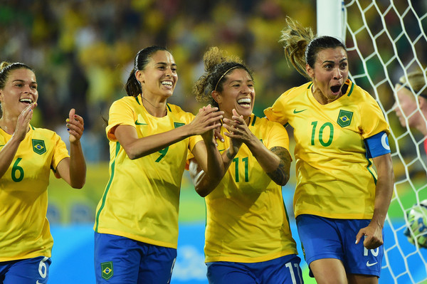 Cristiane celebrates her goal against Sweden with her teammates. it was her record 14th career tally in Olympic competition/Photo: Harry How/Getty Images