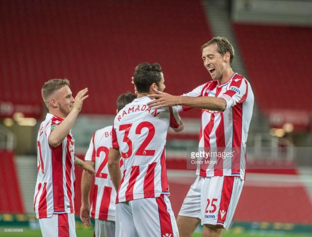 Peter Crouch celebrates with Ramadan Sobhi. Source | Getty Images.