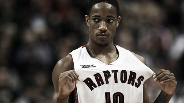 DeMar DeRozan flashes his jersey with the Toronto Raptors. (Dave Sandford/Getty Images)