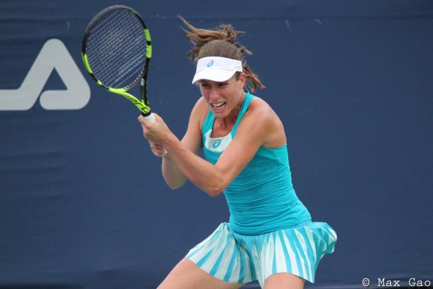 Johanna Konta in action during her doubles match | Photo: Max Gao / VAVEL USA Tennis