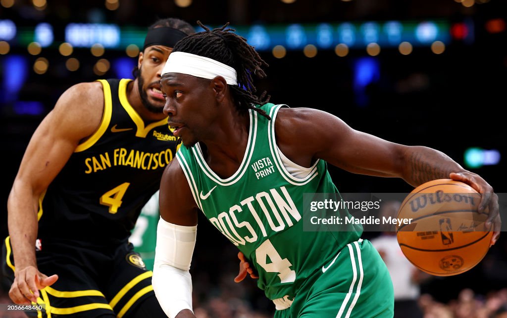Moses Moody #4 of the Golden State Warriors defends Jrue Holiday #4 of the Boston Celtics during the first quarter at TD Garden on March 03, 2024 in Boston, Massachusetts. NOTE TO USER: User expressly acknowledges and agrees that, by downloading and or using this photograph, user is consenting to the terms and conditions of the Getty Images License Agreement. (Photo by Maddie Meyer/Getty Images)