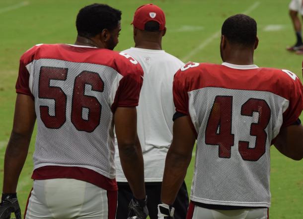 Karlos Dansby (56) and Haason Reddick (43) talking on the sideline during training camp. |Aug. 8, 2017 - Source: Richard Martinez/Vavel|