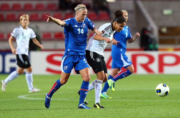 Dagny Brynjarsdottir (left) in a game against Germany during the 2013 UEFA Women's Euro group B match | Source: Martin Rose - Getty Images