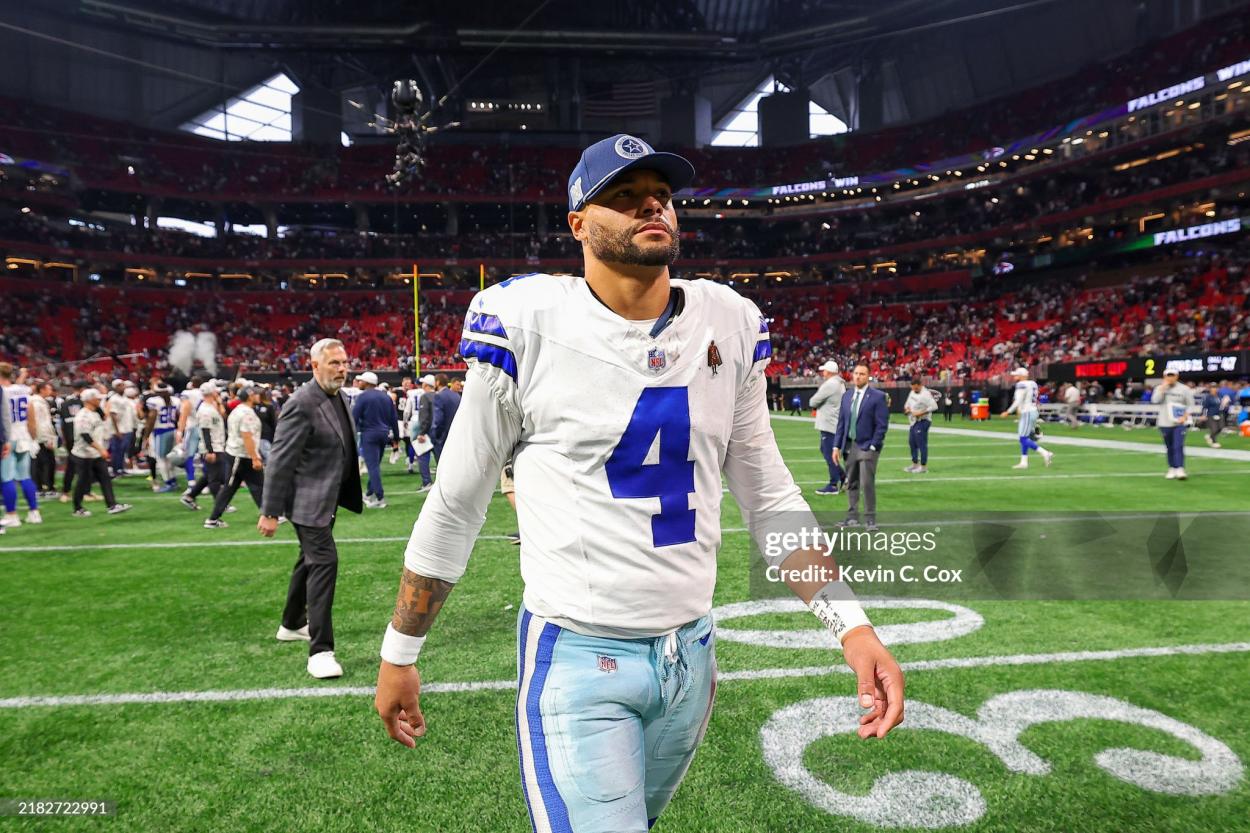 Dak Prescott walks off the field following defeat to the Atlanta Falcons. Photo by Kevin C. Cox/Getty Images