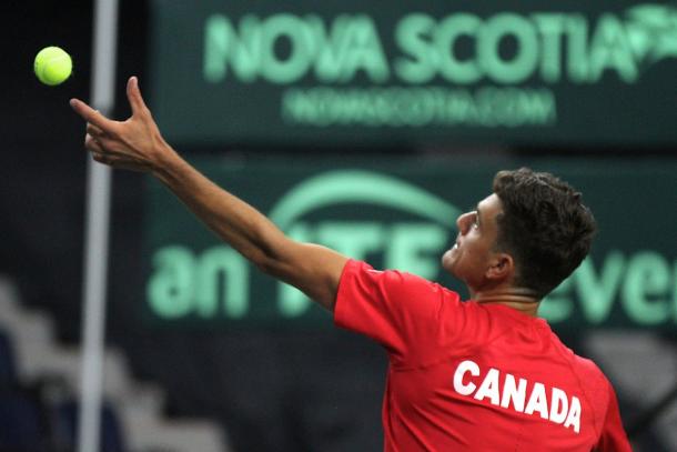 Frank Dancevic serves during his opening match win. Photo: Davis Cup