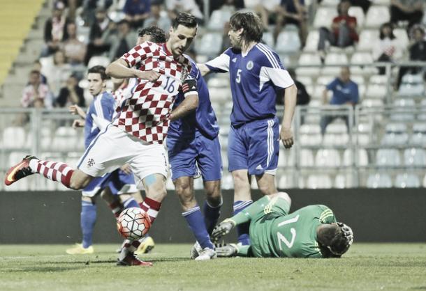 Above: Nikola Kalinic striking home in Croatia's 10-0 win over San Marino | Photo: AP Photo/Darko Bandic