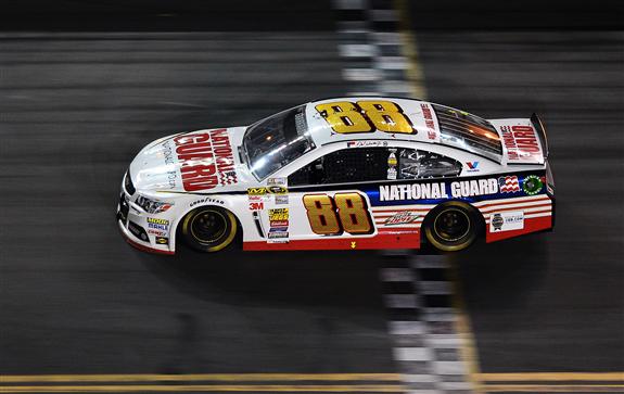 Dale Earnhardt Jr. crosses the finish line to win the 2014 Daytona 500. (Jared C. Tilton/NASCAR via Getty Images)