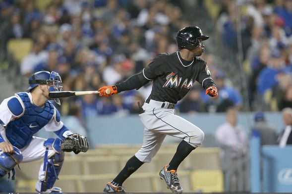Dee Gordon of the Miami Marlins hits an RBI single in the seventh inning against the Los Angeles Dodgers | Stephen Dunn - Getty Images
