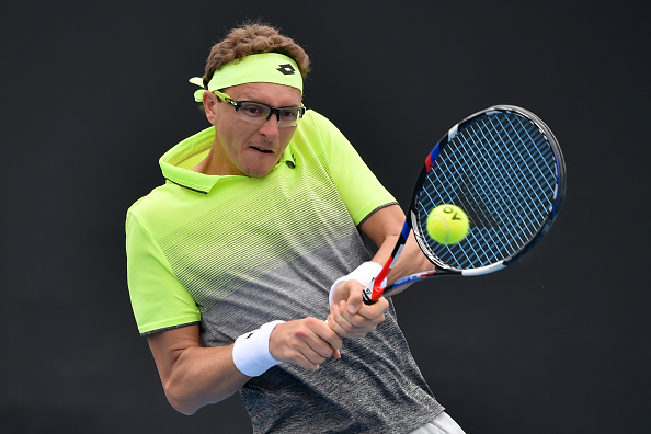 Denis Istomin strikes a backhand shot (Photo: Peter Parks/Getty Images)