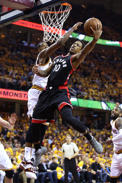 DeRozan contested at the rim by Tristan Thompson. Credit: Andy Lyons/Getty Images North America