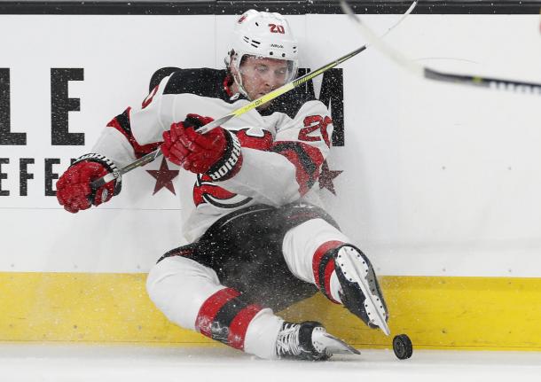 The New Jersey Devils kicked their way past the Vegas Golden Knights in a romp 8-3. (AP Photo/John Locher)