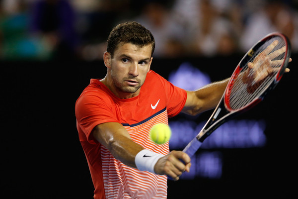 Grigor Dimitrov hits a backhand on Friday in Melbourne. Photo: Zak Kaczmarek/Getty Images