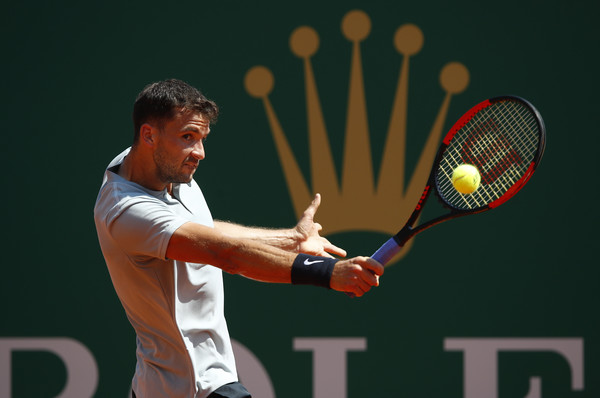 Grigor Dimitrov stretches for a backhand during his semifinal loss. He just could not hang with Nadal after a tough first set. Photo: Julian Finney/Getty Images