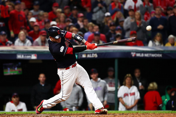 Roberto Perez #55 of the Cleveland Indians hits an RBI single scoring Austin Jackson #26 in the fifth inning against the New York Yankees in Game Five of the American League Divisional Series. |Oct. 11, 2017 - Source: Gregory Shamus/Getty Images North America|