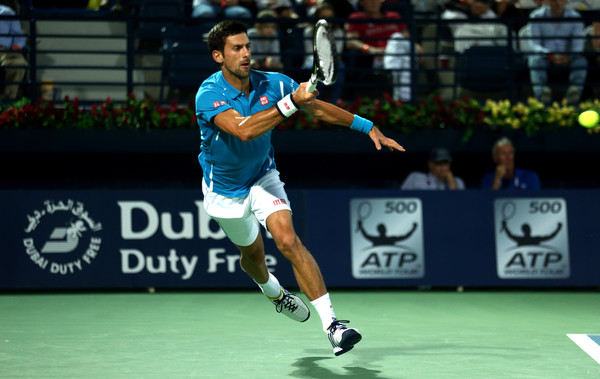 Djokovic hits a forehand during his first round match. Photo: Warren Little/Getty Images