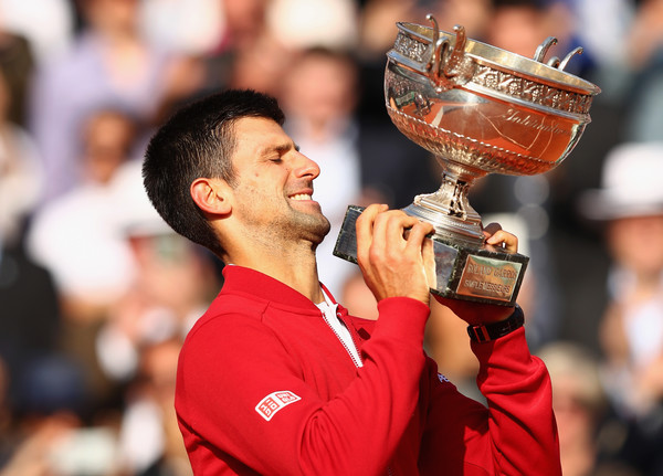 Djokovic hoists his 2016 French Open trophy. Photo: Julian Finney/Getty Images
