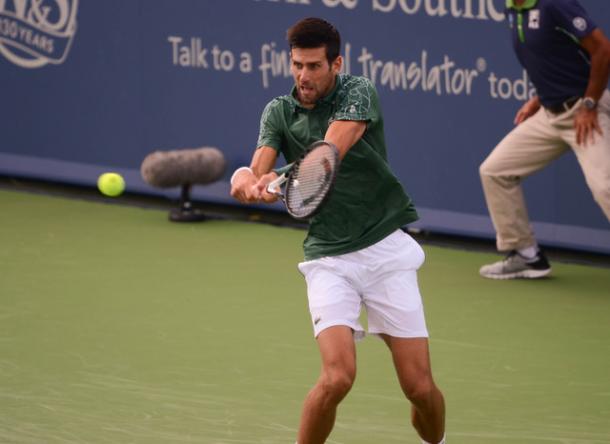 Djokovic strikes a backhand during his quarterfinal win. Photo: Noel Alberto/VAVEL USA