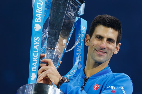 Novak Djokovic hoists the ATP World Tour Finals trophy last year. Photo: Julian Finney/Getty Images