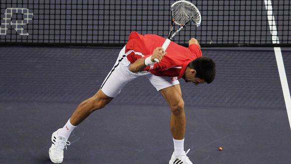 Djokvoic smashes a racquet in Shanghai during a victory. Photo: Lintao Zhang/Getty Images