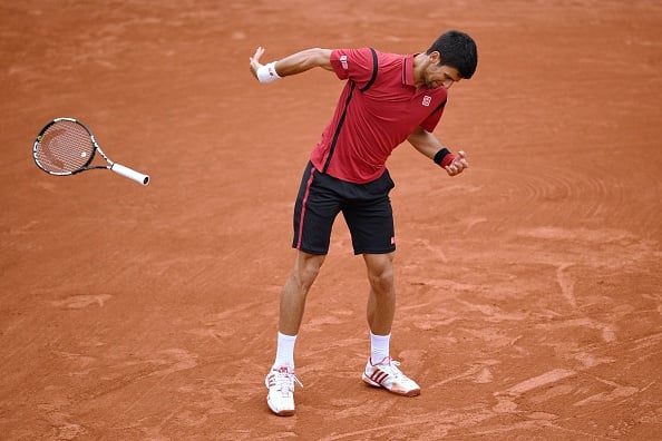 Djokovic throws his racquet, nearly hitting a linesperson in the French Open quarterfinals. Photo: Getty Images