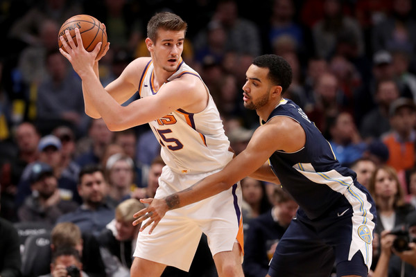 Dragan Bender #35 of the Phoenix Suns is guarded by Trey Lyles #7 of the Denver Nuggets. |Matthew Stockman/Getty Images North America|