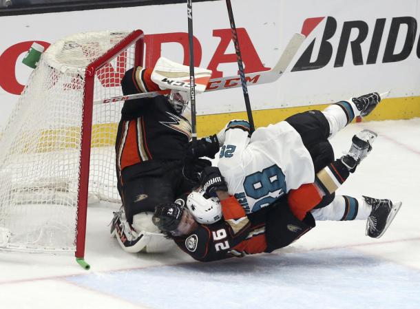 The San Jose Sharks fought the Anaheim Ducks even in the goal crease to take Game 1. (AP Photo/Reed Saxon)