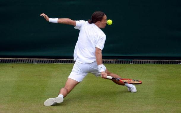 Dolgopolov sliding into a backhand | photo: The Telegraph