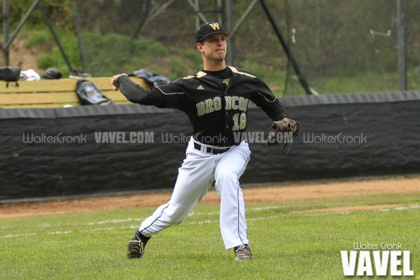 Kyle Mallwitz (18) making the throw to 1st base to get the out. Photo: Walter Cronk