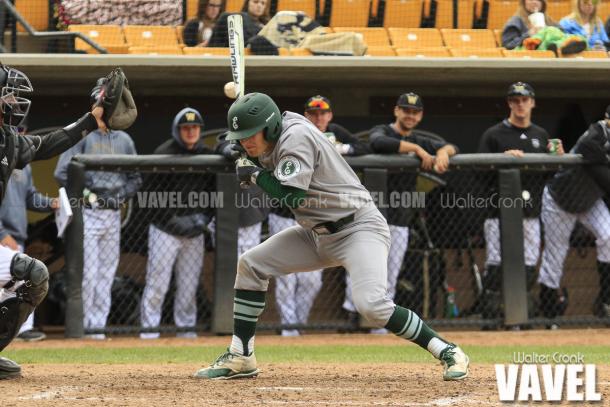 An Eastern Michigan batter narrowly misses getting hit by a pitch. Photo: Walter Cronk