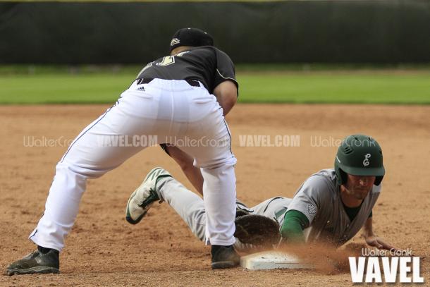 Jesse Forestell (27) doesnt get the tag on the runner in time. Photo: Walter Cronk