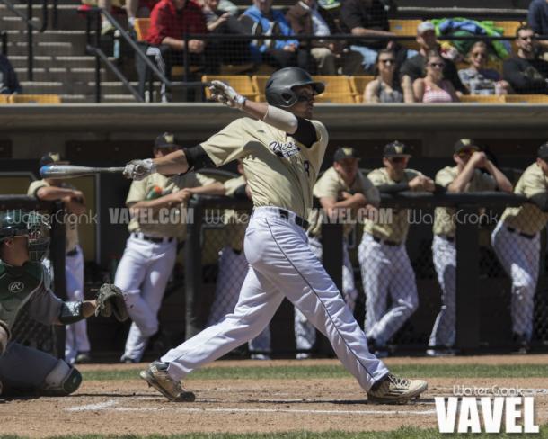 Tanner Allison (8) hits an RBI single to score the first run of the game. Photo: Walter Cronk