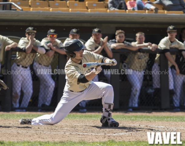 Pinch Hitter Jimmy Roche (10) lays down the sac bunt to move the runners into scoring position. Photo: Walter Cronk
