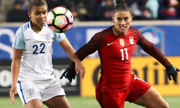 England's Nikita Parris (white) and USWNT Ali Krieger (red) in battle over the ball during the 2017 She Believes Cup. | Photo Dominick Reuter