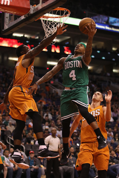 Isaiah Thomas #4 of the Boston Celtics lays up a shot past Eric Bledsoe #2 of the Phoenix Suns. |Source: Christian Petersen/Getty Images North America|